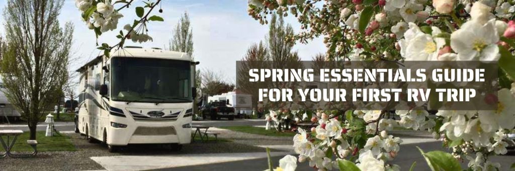 Spring Essentials Guide for Your First RV Trip, RV parked in campsite next to spring flowers